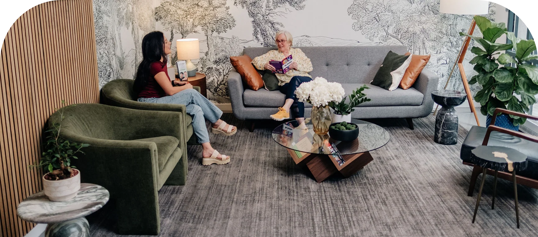 Two patients relaxing in the Enamyl Dentistry lounge in Ballston, Arlington